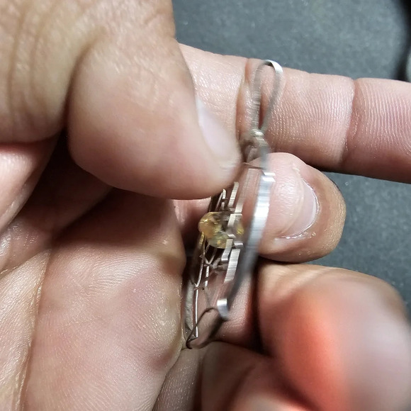 Silver tone dreamcatcher pendant with yellow bead in the center - Picture 3 of 5